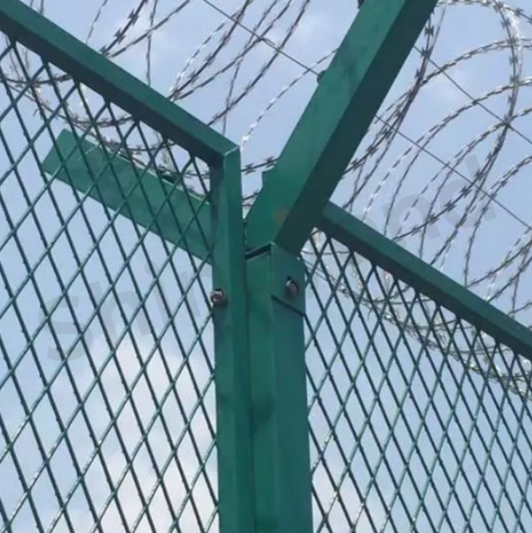 Chain link fence with barbed wire top